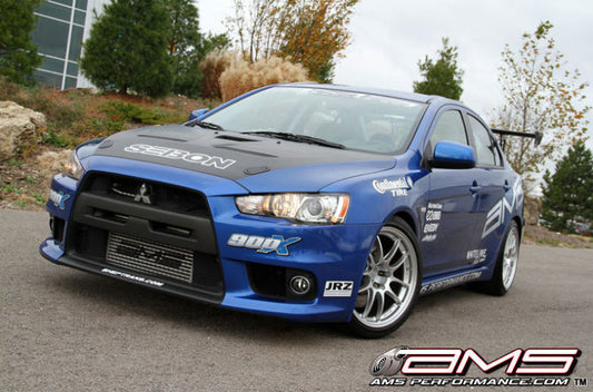 AMS Performance 08-15 Mitsubishi EVO X Front Mount Intercooler w/Modular Cast End Tanks & Logo - awdtuningtx